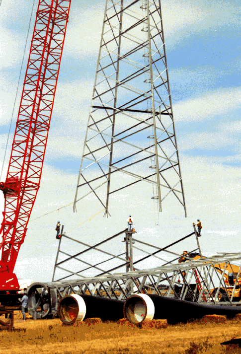 2 The center portion of the 20-story lattice tower is lifted into place