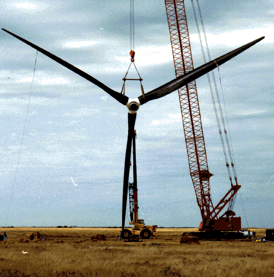 7 Crane lifts the 50 meter diameter rotor to the top of unit number one