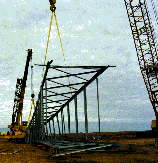 1 Assembly of the top portion of the 123,000 lb. lattice tower