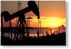 A typical oil field at sunset